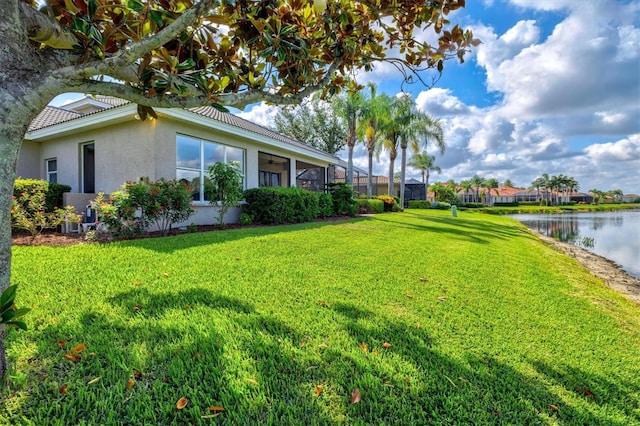 8930 Bloomfield Blvd, Sarasota, FL 34238 - view of green lawn with a water view