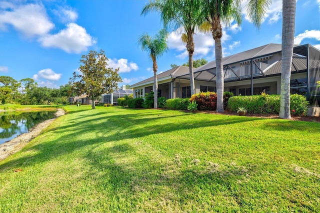 8930 Bloomfield Blvd, Sarasota, FL 34238 - view of grassy yard with a lanai and a water view
