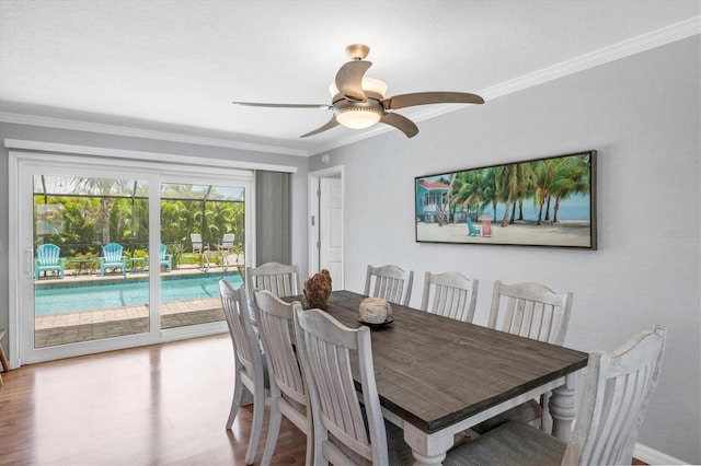 7913 19th Avenue Dr W, Bradenton, FL 34209 - dining space with ornamental molding, a ceiling fan, and wood finished floors