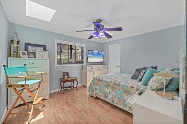 7913 19th Avenue Dr W, Bradenton, FL 34209 - bedroom with a skylight, ornamental molding, light wood-style floors, and ceiling fan