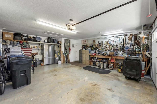 7913 19th Avenue Dr W, Bradenton, FL 34209 - garage with a workshop area, freestanding refrigerator, and a garage door opener