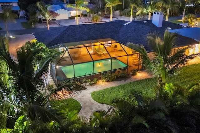 7913 19th Avenue Dr W, Bradenton, FL 34209 - back of property featuring an outdoor pool and glass enclosure