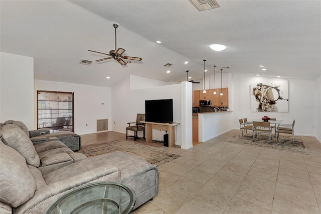 5651 Golf Pointe Dr Unit 5651, Sarasota, FL 34243 - living area featuring vaulted ceiling, a ceiling fan, and light tile patterned floors