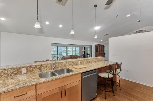 5651 Golf Pointe Dr Unit 5651, Sarasota, FL 34243 - kitchen with stainless steel dishwasher, a sink, vaulted ceiling, a ceiling fan, and light wood-style floors
