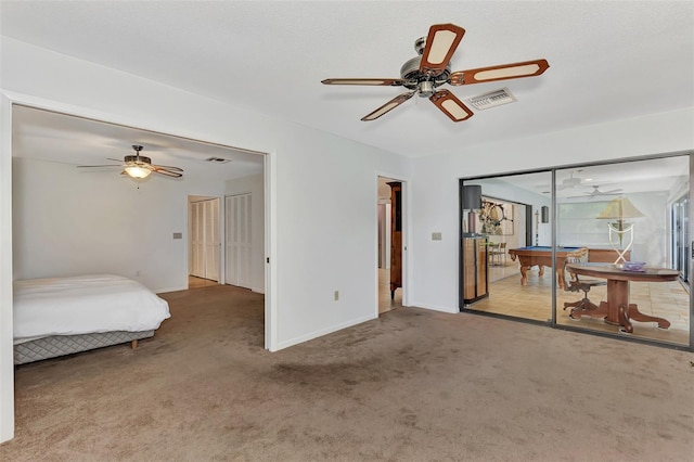 5651 Golf Pointe Dr Unit 5651, Sarasota, FL 34243 - bedroom featuring carpet, baseboards, and ceiling fan
