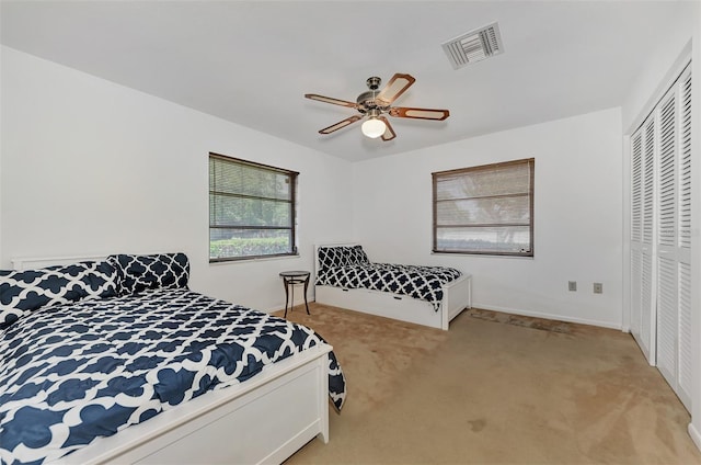 5651 Golf Pointe Dr Unit 5651, Sarasota, FL 34243 - carpeted bedroom with a closet and a ceiling fan