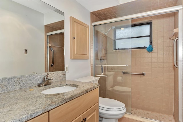 5651 Golf Pointe Dr Unit 5651, Sarasota, FL 34243 - bathroom featuring vanity, toilet, and a stall shower