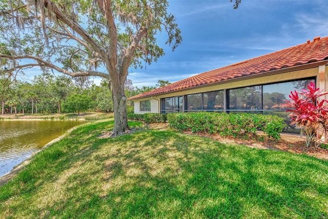 5651 Golf Pointe Dr Unit 5651, Sarasota, FL 34243 - view of grassy yard featuring a water view