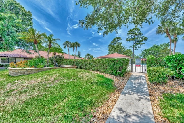 5651 Golf Pointe Dr Unit 5651, Sarasota, FL 34243 - view of yard with a gate