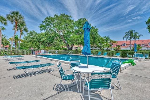 5651 Golf Pointe Dr Unit 5651, Sarasota, FL 34243 - community pool with a patio area