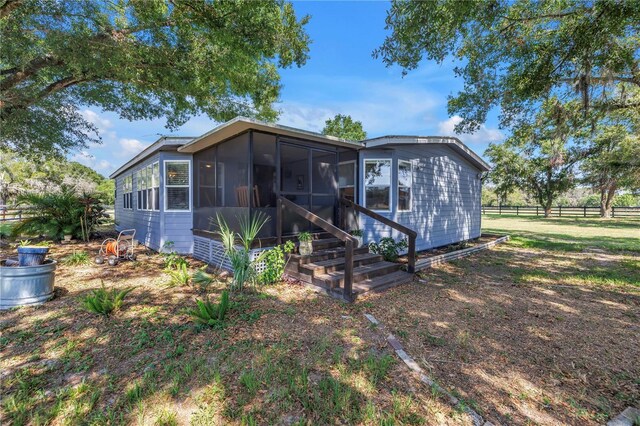 12714 Tyler Run Ave, Odessa, FL 33556 - back of property with a sunroom