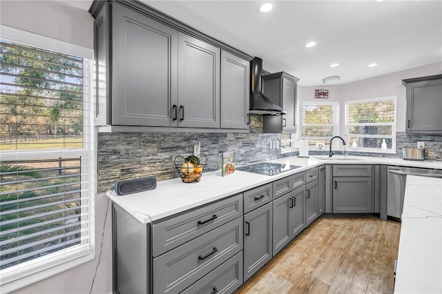 12714 Tyler Run Ave, Odessa, FL 33556 - kitchen with dishwasher, wall chimney range hood, a sink, black electric stovetop, and gray cabinets