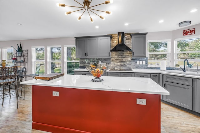 12714 Tyler Run Ave, Odessa, FL 33556 - kitchen with gray cabinetry, wall chimney exhaust hood, a sink, and recessed lighting