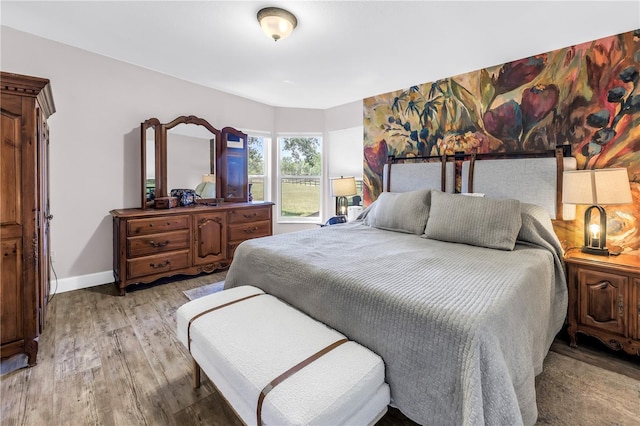 12714 Tyler Run Ave, Odessa, FL 33556 - bedroom with light wood-type flooring and baseboards