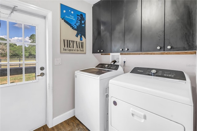 12714 Tyler Run Ave, Odessa, FL 33556 - washroom with cabinet space, washing machine and clothes dryer, baseboards, and dark wood-style flooring