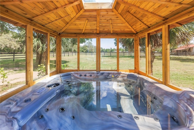 12714 Tyler Run Ave, Odessa, FL 33556 - sunroom with a hot tub, plenty of natural light, and a skylight