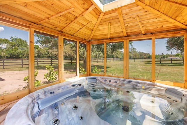 12714 Tyler Run Ave, Odessa, FL 33556 - unfurnished sunroom with a hot tub, a skylight, and view of scattered trees