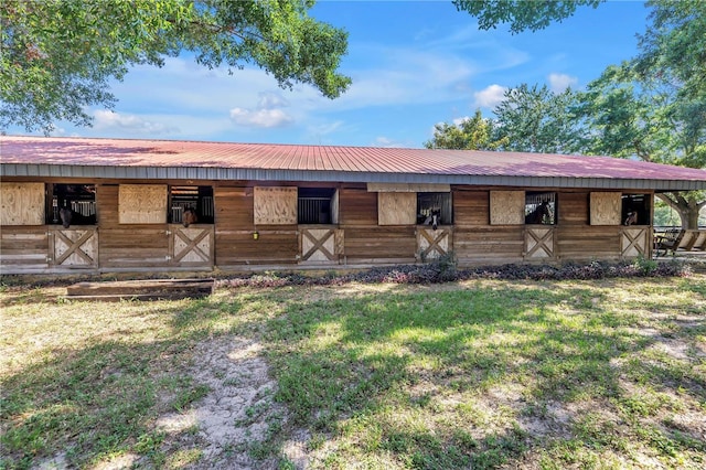 12714 Tyler Run Ave, Odessa, FL 33556 - view of front of house with an exterior structure, an outbuilding, and metal roof