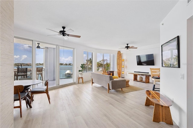 516 Tamiami Trl S Unit 306, Nokomis, FL 34275 - living room with ceiling fan and light wood-style flooring