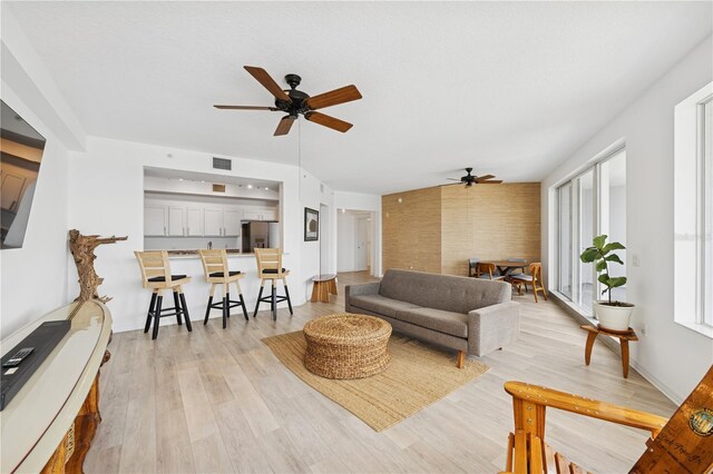 516 Tamiami Trl S Unit 306, Nokomis, FL 34275 - living room featuring ceiling fan and light wood-type flooring