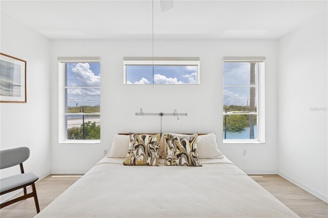 516 Tamiami Trl S Unit 306, Nokomis, FL 34275 - bedroom with light wood-style floors and baseboards