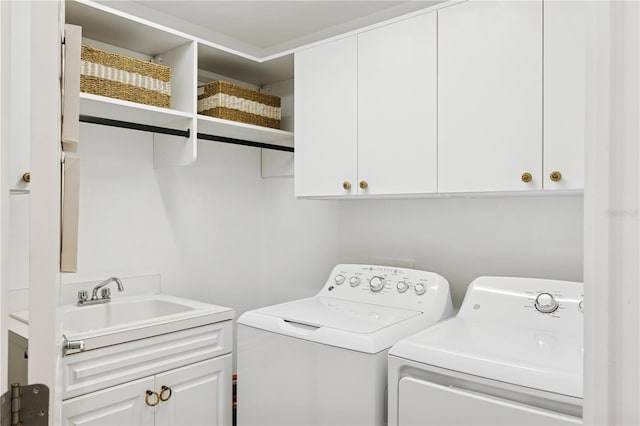 516 Tamiami Trl S Unit 306, Nokomis, FL 34275 - laundry room featuring cabinet space and washer and clothes dryer