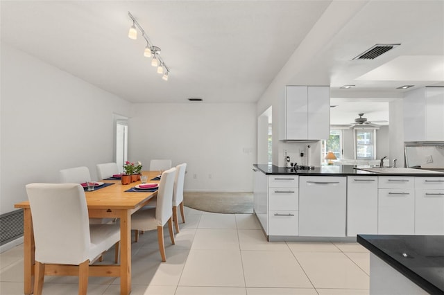 139 Adair Ave, Sarasota, FL 34243 - kitchen featuring modern cabinets, white cabinetry, dark countertops, and ceiling fan