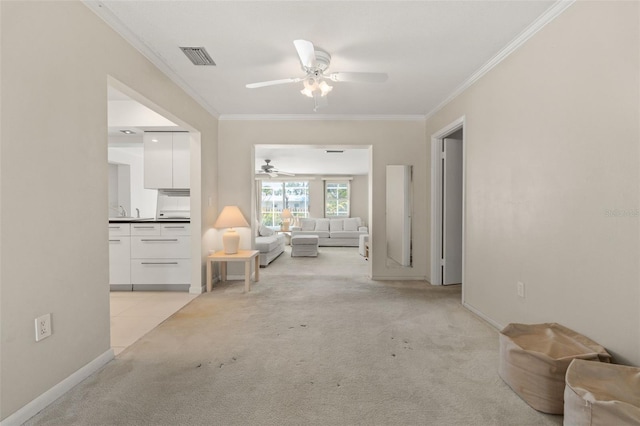 139 Adair Ave, Sarasota, FL 34243 - living area with a ceiling fan, crown molding, light colored carpet, and baseboards