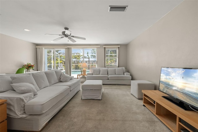 139 Adair Ave, Sarasota, FL 34243 - living room featuring a ceiling fan and light carpet