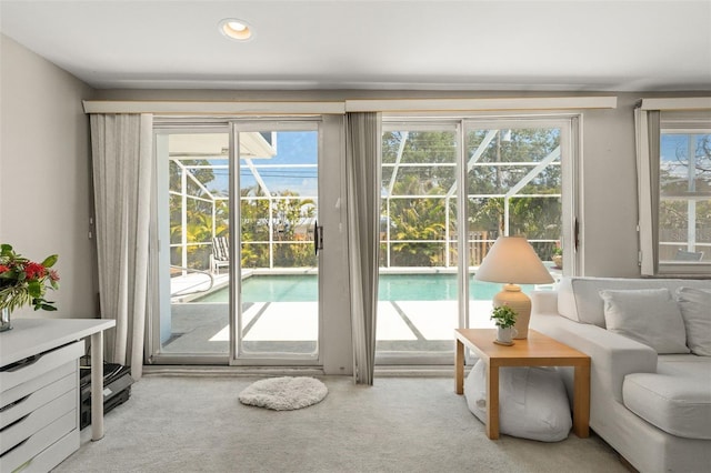 139 Adair Ave, Sarasota, FL 34243 - doorway to outside with a sunroom, carpet flooring, and recessed lighting