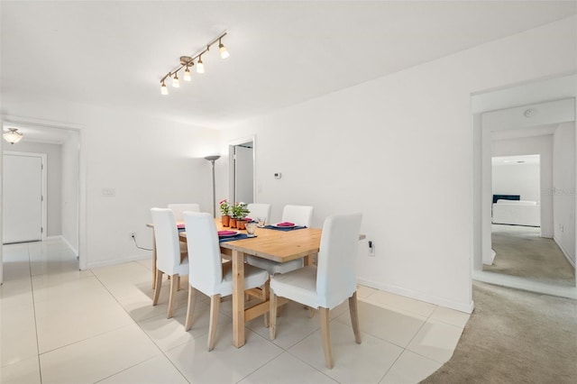 139 Adair Ave, Sarasota, FL 34243 - dining room with light tile patterned flooring and baseboards