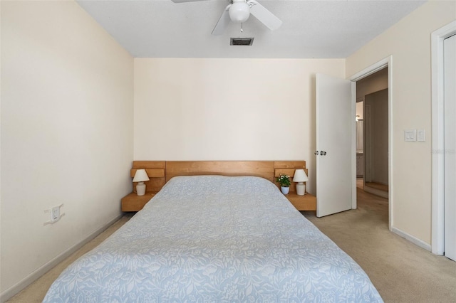 139 Adair Ave, Sarasota, FL 34243 - bedroom with light carpet, a ceiling fan, and baseboards