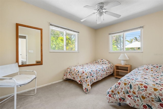 139 Adair Ave, Sarasota, FL 34243 - carpeted bedroom with baseboards and a ceiling fan