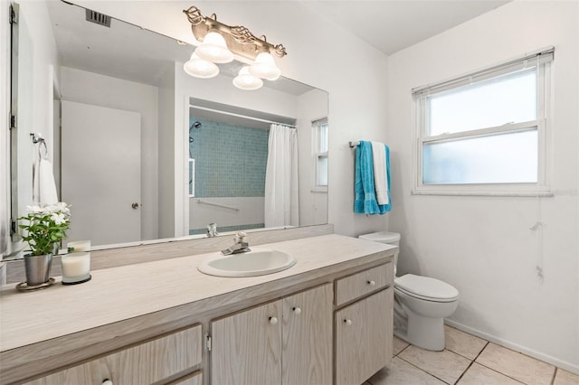 139 Adair Ave, Sarasota, FL 34243 - full bathroom with tile patterned flooring, vanity, toilet, curtained shower, and baseboards