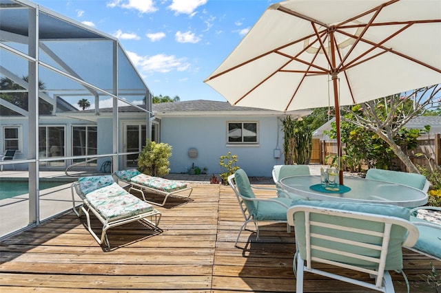 139 Adair Ave, Sarasota, FL 34243 - wooden terrace featuring an outdoor pool, glass enclosure, and outdoor dining space