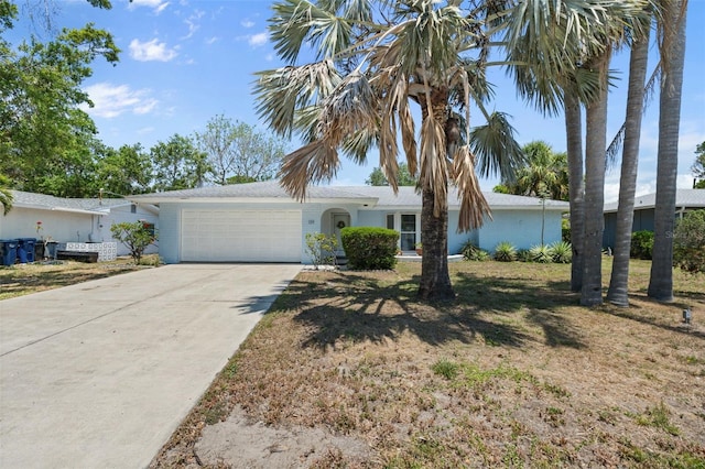 139 Adair Ave, Sarasota, FL 34243 - ranch-style house featuring an attached garage and driveway