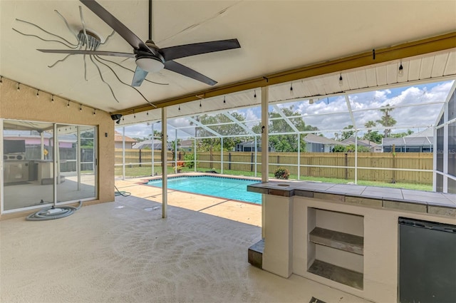 5742 39th Street Cir E, Bradenton, FL 34203 - view of swimming pool with a fenced backyard, a patio, glass enclosure, and ceiling fan