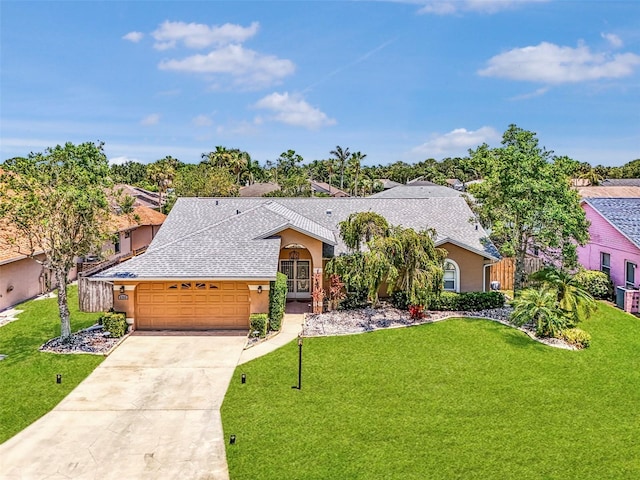 5742 39th Street Cir E, Bradenton, FL 34203 - view of front of home featuring stucco siding, an attached garage, and a front yard