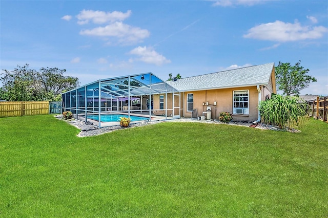 5742 39th Street Cir E, Bradenton, FL 34203 - rear view of property with stucco siding and glass enclosure