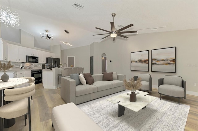5742 39th Street Cir E, Bradenton, FL 34203 - living area with lofted ceiling, light wood-style floors, and ceiling fan
