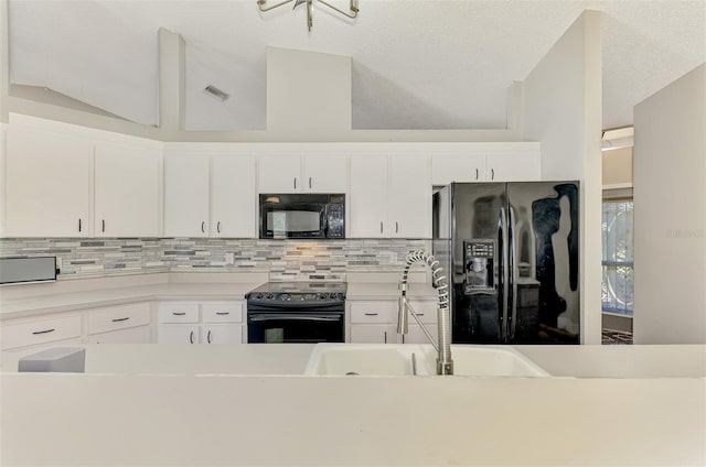 5742 39th Street Cir E, Bradenton, FL 34203 - kitchen with black appliances, a sink, decorative backsplash, white cabinets, and light countertops