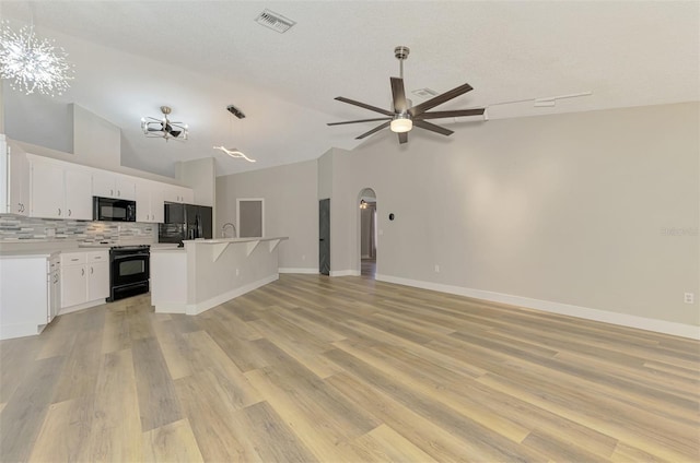 5742 39th Street Cir E, Bradenton, FL 34203 - kitchen featuring black appliances, ceiling fan, lofted ceiling, open floor plan, and decorative backsplash