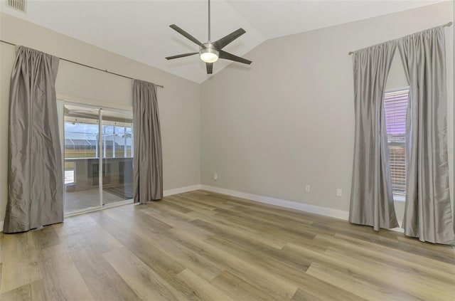 5742 39th Street Cir E, Bradenton, FL 34203 - spare room featuring lofted ceiling, a ceiling fan, light wood finished floors, and baseboards