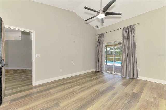 5742 39th Street Cir E, Bradenton, FL 34203 - unfurnished room with a ceiling fan, vaulted ceiling, wood finished floors, and baseboards