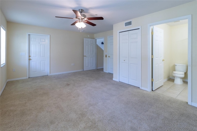 3409 10th Ln W, Palmetto, FL 34221 - unfurnished bedroom with carpet, connected bathroom, baseboards, and ceiling fan