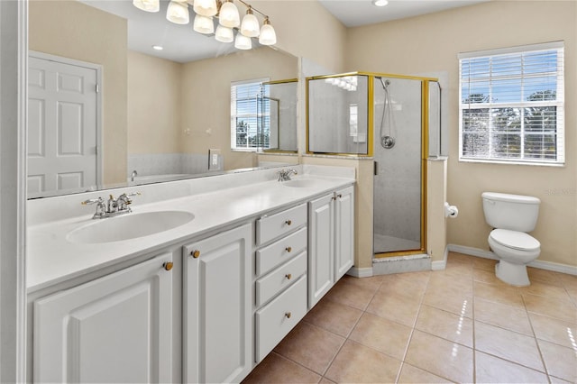 3409 10th Ln W, Palmetto, FL 34221 - full bath with healthy amount of natural light, double vanity, a stall shower, and toilet