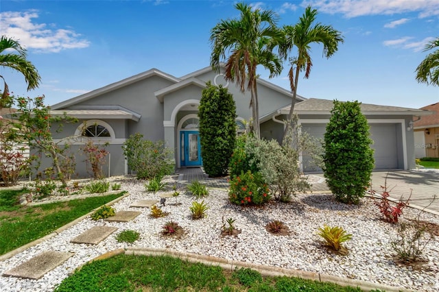 6113 55th Ter E, Bradenton, FL 34203 - view of front of property featuring a garage, stucco siding, and concrete driveway