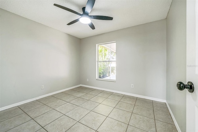 1062 Blossom Dr, Sebastian, FL 32958 - unfurnished room featuring ceiling fan, tile patterned floors, a textured ceiling, and baseboards
