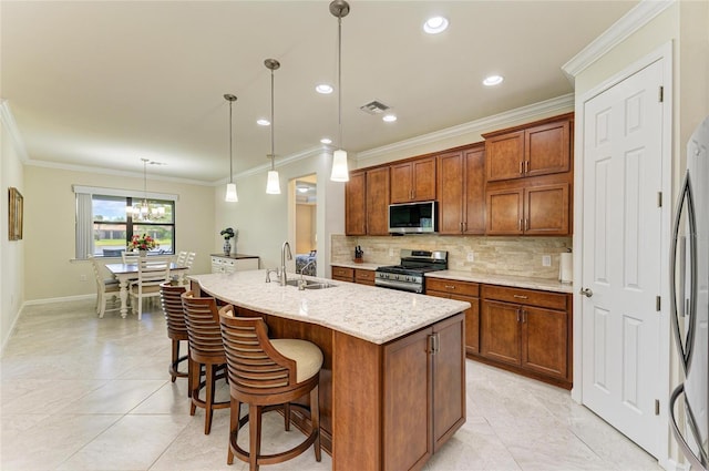 6756 Chester Trl, Lakewood Ranch, FL 34202 - kitchen with stainless steel appliances, a sink, decorative backsplash, light tile patterned floors, and crown molding