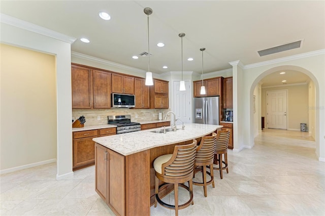 6756 Chester Trl, Lakewood Ranch, FL 34202 - kitchen with appliances with stainless steel finishes, a sink, arched walkways, backsplash, and recessed lighting